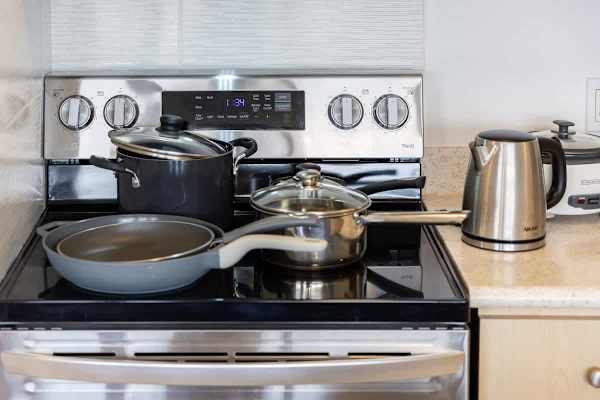 Prepare your favorite meals with ease using the full-size stove and oven provided in the kitchen.
