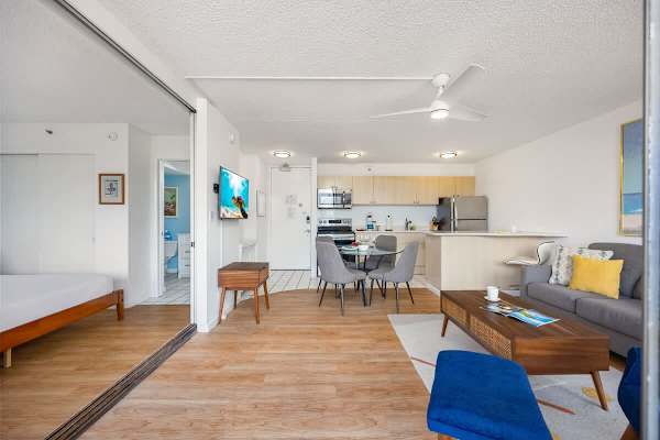 Enjoy a spacious, open-concept living area that seamlessly flows from the kitchen and dining space to the bedroom, offering both comfort and convenience.