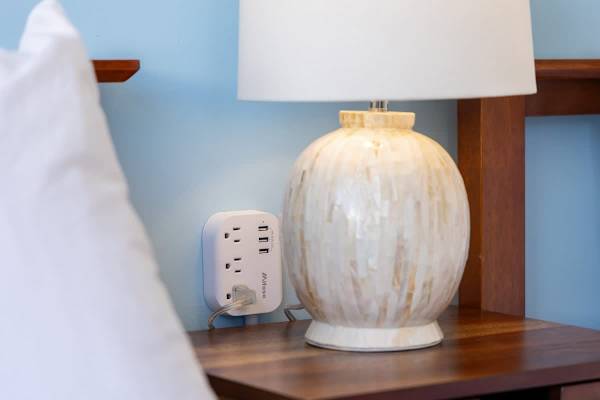 Stay connected and charged with the convenient USB charging station located right next to the bed.