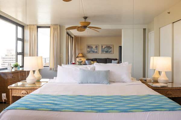 King size bed, two night stands and ceiling fan 