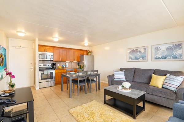 Overview of the living room with dining table and kitchen 
