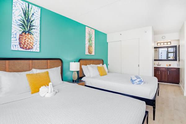 Bedroom with 2 queen beds, a closet, and access to the bathroom.