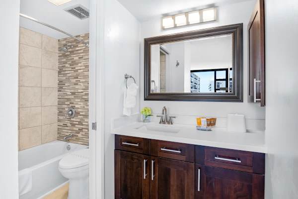 Full bathroom with tub and shower combo.