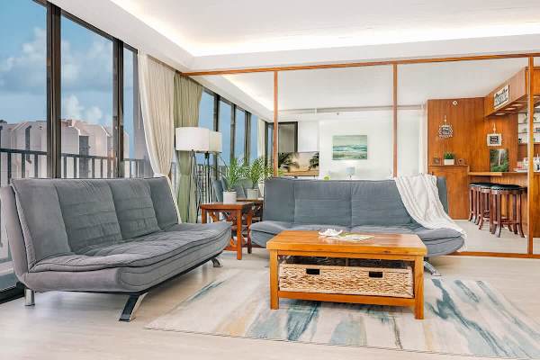 Your living room has 2 comfortable recliner futon sofas and a coffee table.