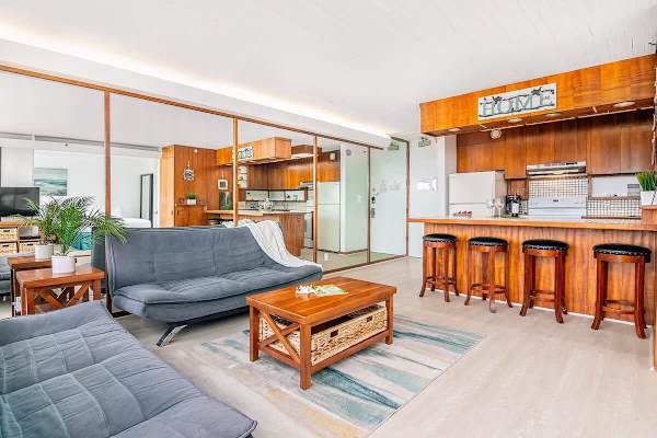 Living room and dining area with 4 bar stools.