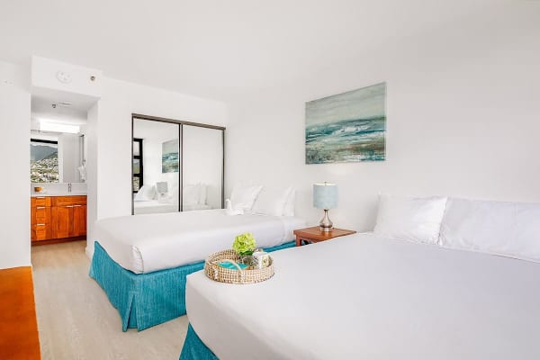 Relax in your bedroom with 2 queen size beds, a closet, and access to the bathroom.