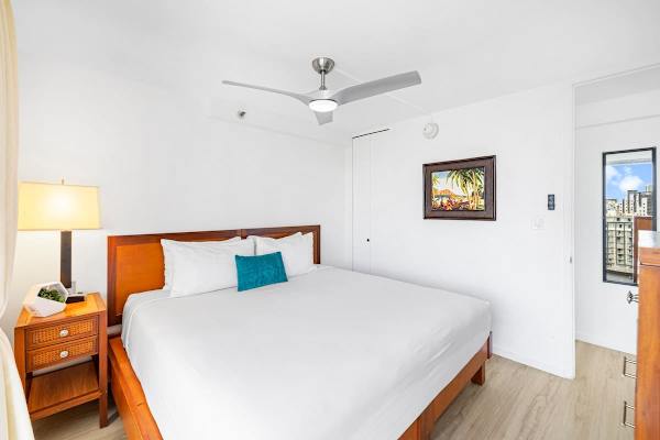 The bedroom features a king-size bed and ceiling fan for your comfort!