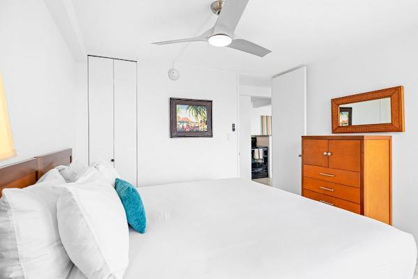 The bedroom features a king-size bed and ceiling fan for your comfort!