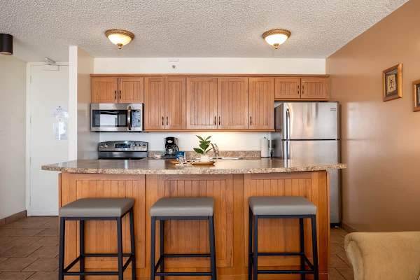 Enjoy casual meals or a morning coffee at the convenient breakfast bar, providing a comfortable and inviting spot for dining within your fully equipped kitchen.