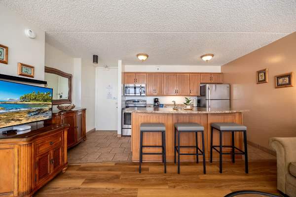 Enjoy casual meals or a morning coffee at the convenient breakfast bar, providing a comfortable and inviting spot for dining within your fully equipped kitchen.
