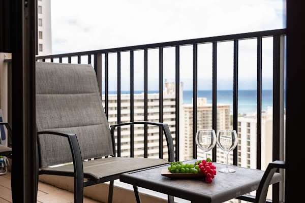 Sip and savor the stunning ocean and city views from your private lanai, the perfect spot for a relaxing evening or morning coffee.