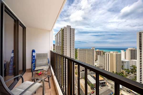 Bask in breathtaking views of the city skyline and the sparkling ocean from your expansive private lanai, complete with seating for ultimate relaxation.