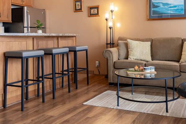 Enjoy casual dining or morning coffee at the stylish breakfast bar, perfectly situated in this inviting open-concept living space.