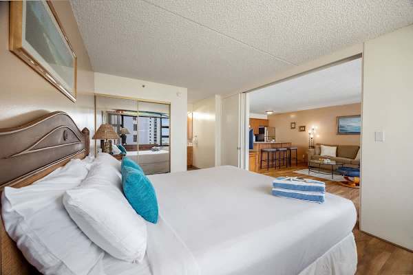 The bedroom offers a king-size bed, serene views, and direct access to both the private bathroom and the bright, open living area, ensuring a seamless and relaxing stay.