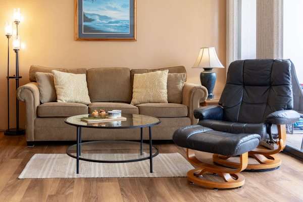 Settle into the cozy pull-out sleeper sofa or plush recliner in this inviting living area, perfect for unwinding after a day of exploring.