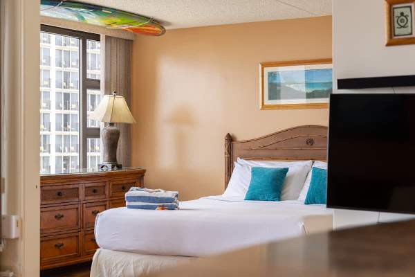 Drift into a restful sleep in your cozy bedroom, featuring a plush king-size bed, stylish furnishings, and thoughtful touches for a truly relaxing stay.
