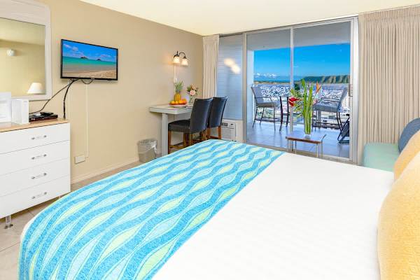 Queen size bed, adjustable height table with chairs, dresser and flat screen TV