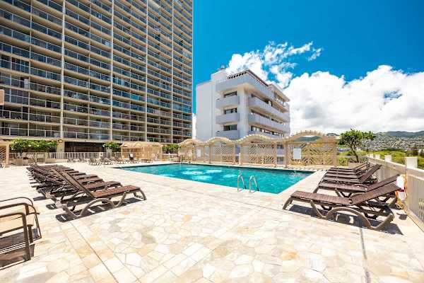 Take a refreshing dip in our sparkling outdoor pool, surrounded by comfortable lounge chairs and shaded cabanas, perfect for soaking up the Hawaiian sun.