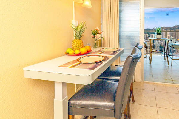 Adjustable height table with two chairs