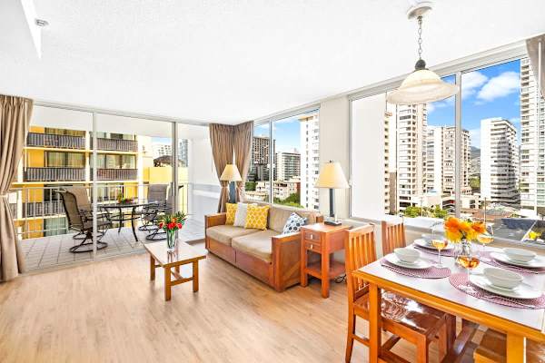 Spacious living room with pull-out sleeper sofa, and coffee table, and dining table with 4 chairs.