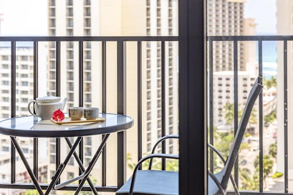 Enjoy having coffee on your balcony with city views.
