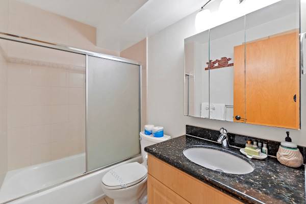 Full bathroom with tub and shower combo