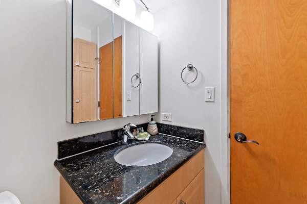 Bathroom with vanity and  cabinet