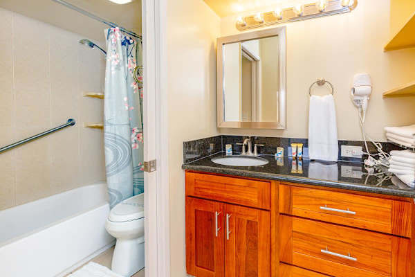Full bathroom with tub and shower combo.