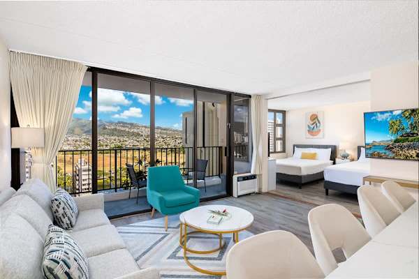 Modern living area with balcony and mountain views