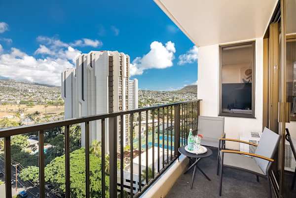 Relax on the balcony with city and mountain views in this comfortable urban retreat.
