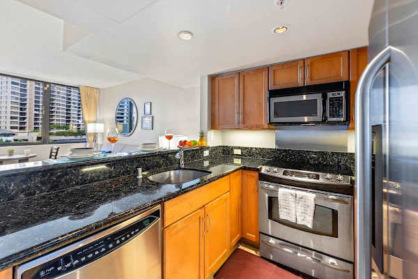 Kitchen with dishwasher, oven, stove, fridge and microwave