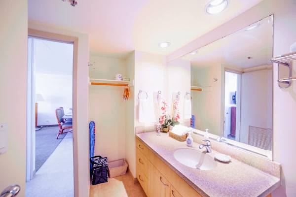 Full bathroom with vanity and cabinet