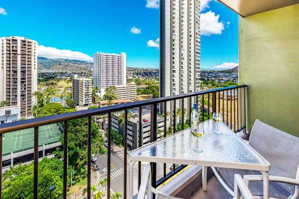 Relax on the balcony with city and mountain views.
