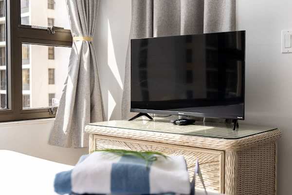 There is a TV in the bedroom