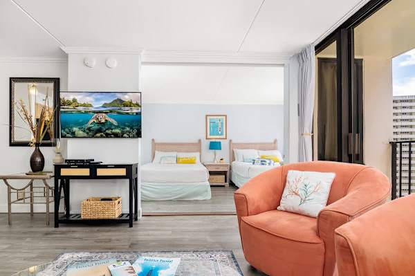 The bedroom and the living room are separated by a sliding room