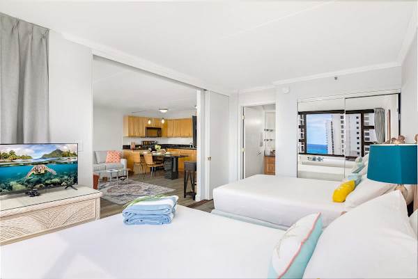 The bedroom and the living room are separated by a sliding room
