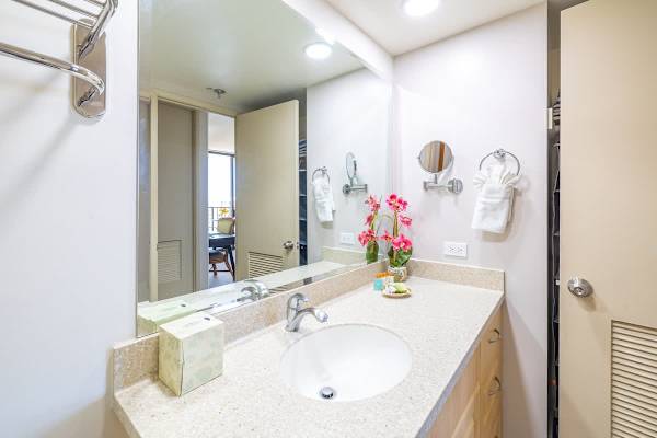 Bathroom with vanity and cabinet