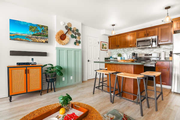 Dining area with 4 chairs and 40" Smart TV in the living room