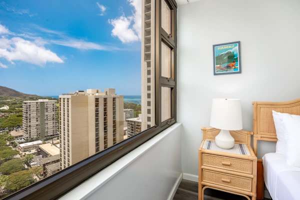 Wake up to partial ocean views, cityscapes, and a glimpse of Diamond Head from your bedroom.