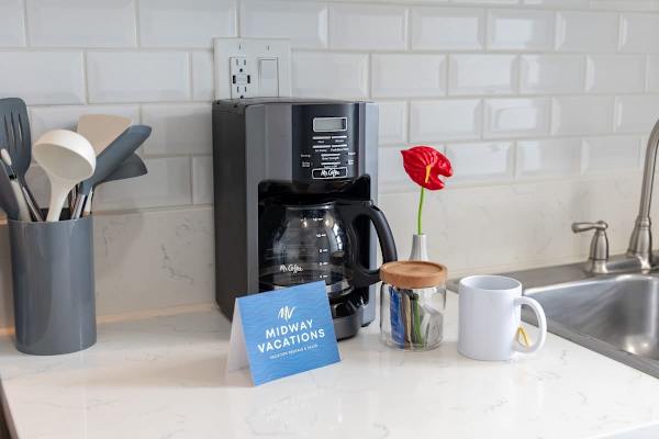 Start your day right with a fresh brew from our convenient coffee maker in the kitchen.