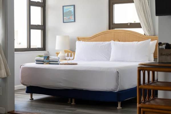 Drift into peaceful slumber on our king-size bed, perfectly appointed with linens and thoughtful touches for a truly restful stay.