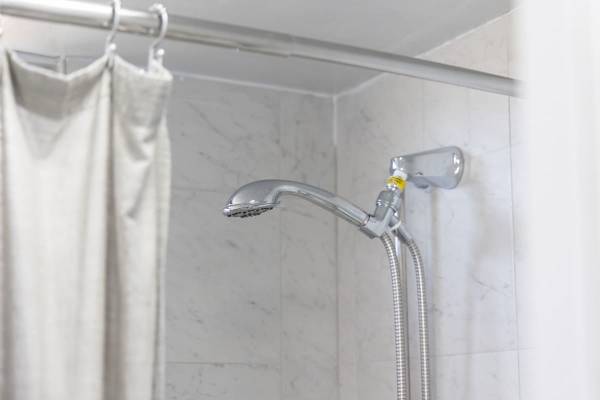 Step into a revitalizing experience with our convenient handheld shower, perfect for a refreshing cleanse after a day of exploring.