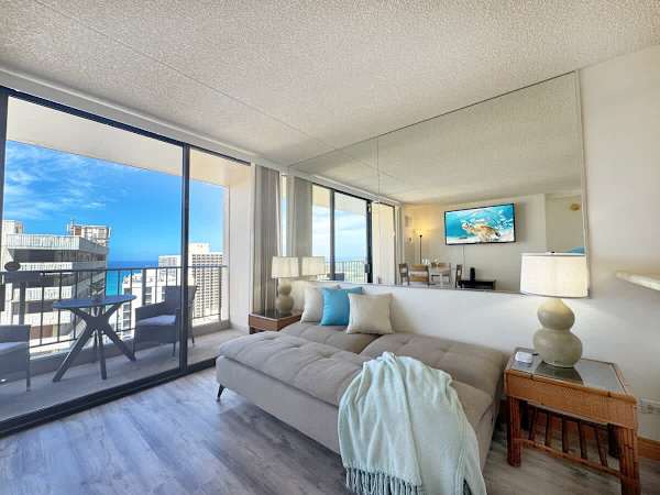 Relax on the cozy sofa and take in the stunning ocean view.