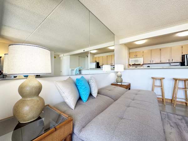 Kick back and relax on the cozy futon sofa, with the kitchen and breakfast bar just steps away.