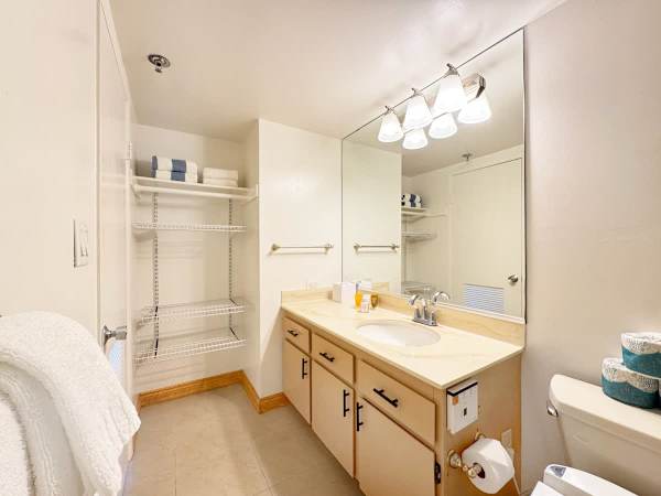 This bathroom provides ample counter space and storage, perfect for keeping all your travel essentials organized.