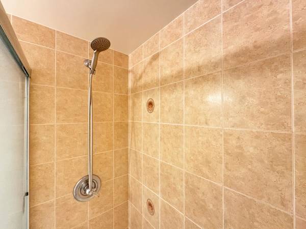 Refresh and recharge in your bathroom with a handheld shower head for your convenience.