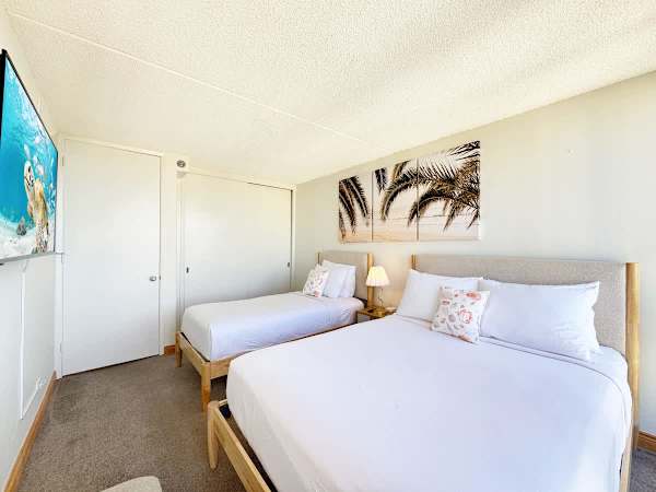 Perfect for relaxing, this bedroom features a king bed and a twin bed, ensuring everyone has a comfortable place to rest.
