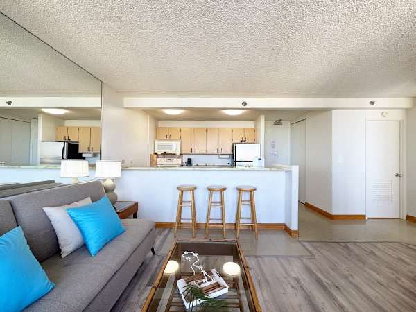 Relax in this inviting open-concept living area, where the kitchen seamlessly flows into the living room.