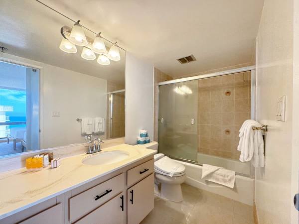 Wash away your stress in this bathroom, complete with a tub and a shower