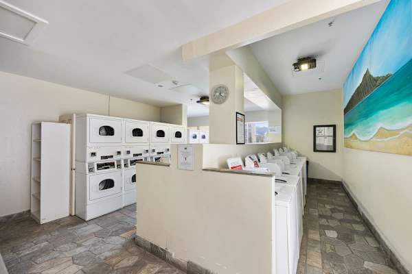 Shared space laundry area on the 6th floor with coin and card-operated washers and dryers